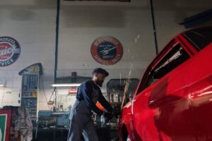 Auto body repair technician technician polishing car body