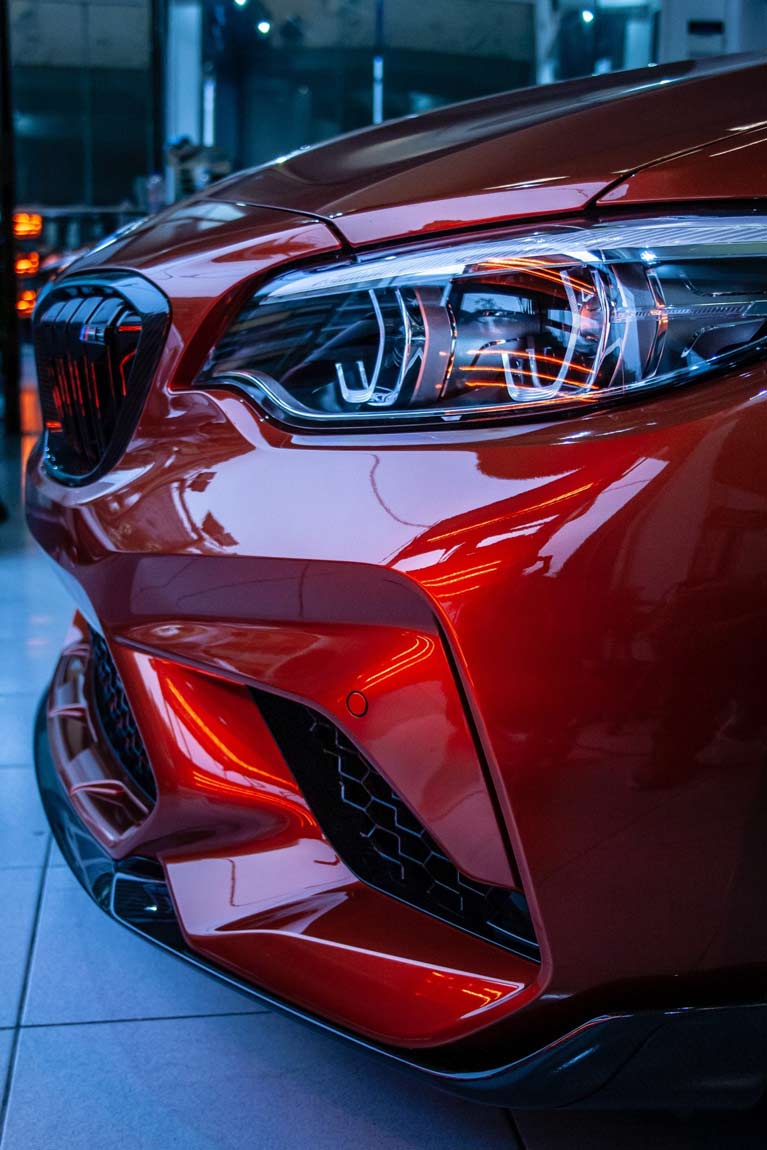 Bumper Display of A Red Metallic Car