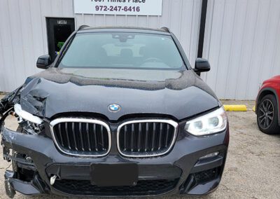 Black BMW With Damaged Front End