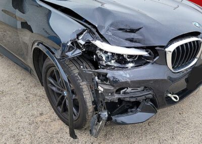 Damaged BMW With Broken Front End