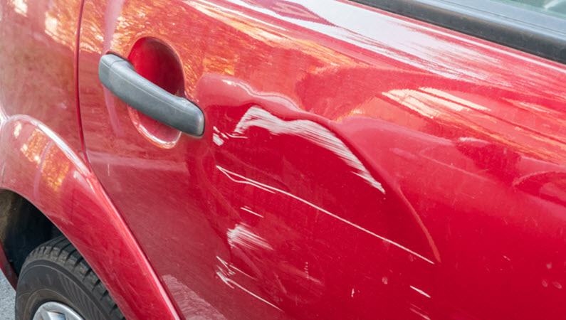 Scratches on Red Car